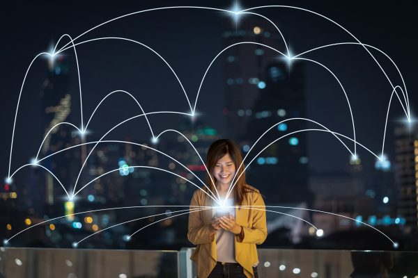 Asian,Businesswoman,Using,Smart,Mobile,Phone,For,Computer,Network,Connection